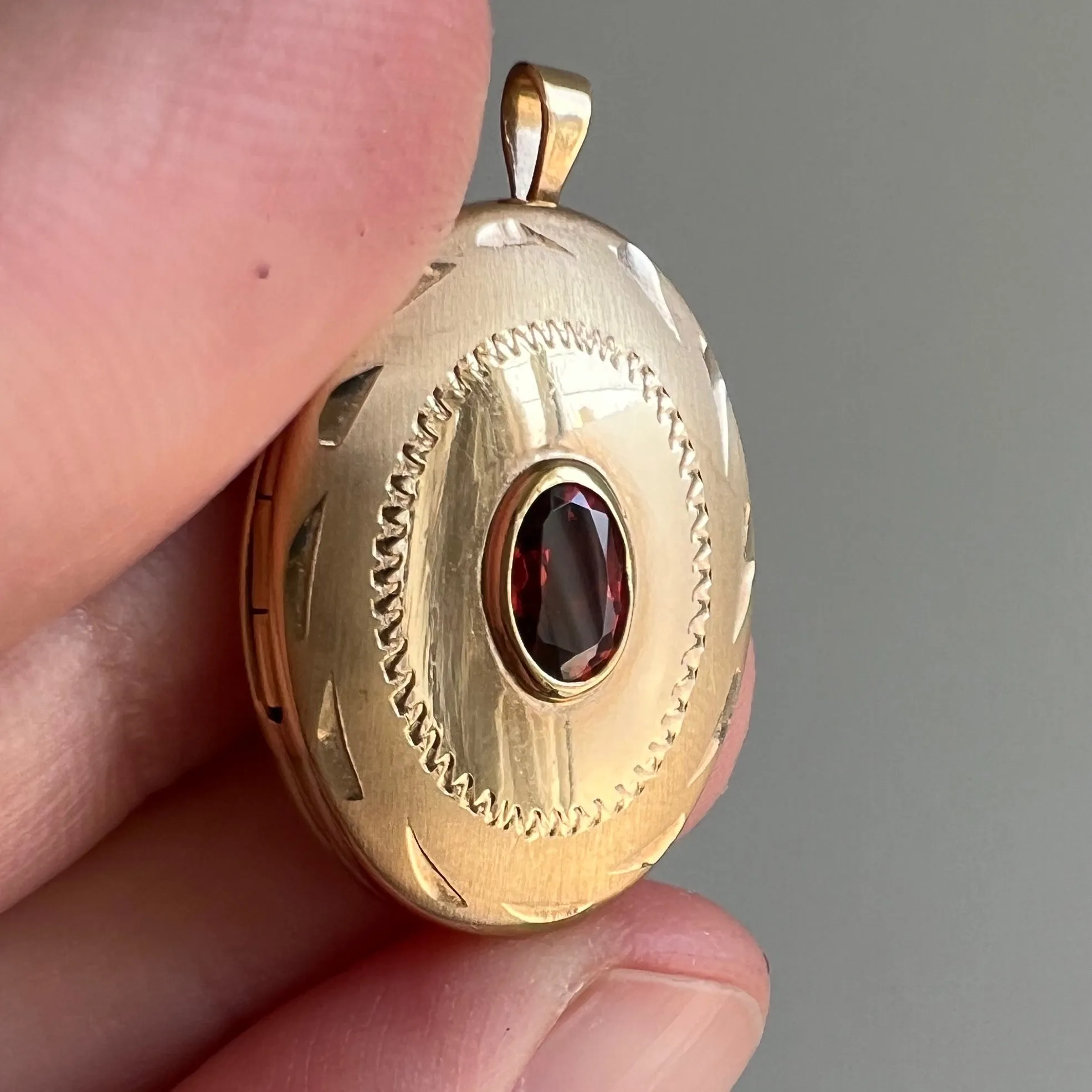 V I N T A G E // faceted memories / 14k and garnet oval locket with engraved details / a pendant all